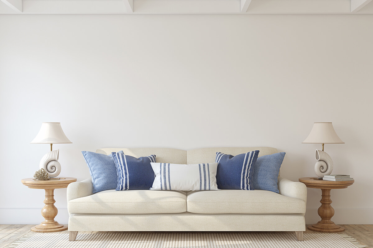 Coastal inspired living room design with blue tones and nautical accent decorations
