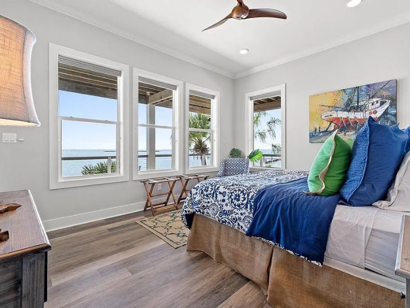 Coastal inspired bedroom in an oceanfront home